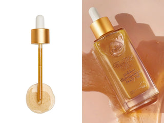 Gold bottle and dropper with 'Glow Oil' text on a beige background